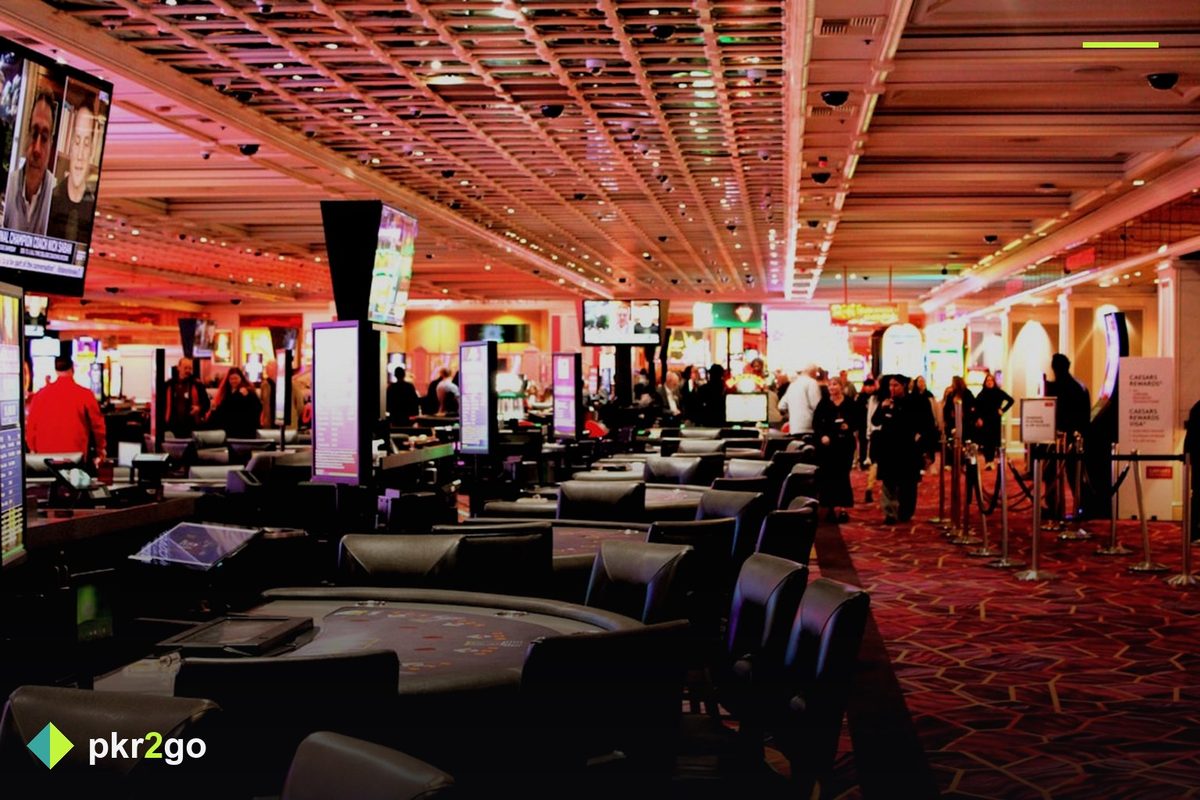 A poker tournament floor with rows of tables